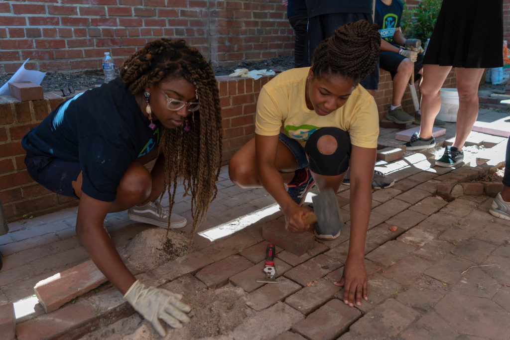 Students work on a restoration project.